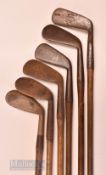 6x Tom Stewart Pipe Mark irons and putters featuring a Mashie niblick (pitted, no grip, shaft