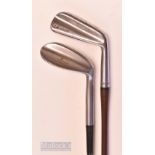 2x steel shafted golf clubs – Tom Stewart “Stewart Supreme” wide sole Blaster – and a Wilson