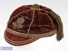 Rare and early 1870/80s England International Rugby Cap - a maroon panelled cap with braided rose