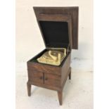 MONARCH RECORD PLAYER with three speed settings, contained in an oak case with a lift up lid and a