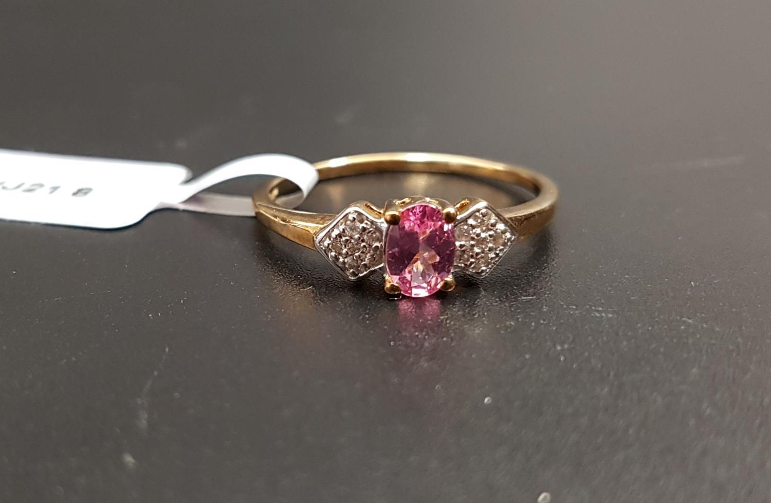 CERTIFIED PINK SPINEL AND WHITE ZIRCON RING the central oval cut pink spinel weighing 0.48cts,