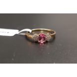 CERTIFIED PINK SPINEL AND WHITE ZIRCON RING the central oval cut pink spinel weighing 0.48cts,
