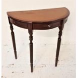 MAHOGANY D SHAPED SIDE TABLE with an inset leather top above a frieze drawer, standing on turned
