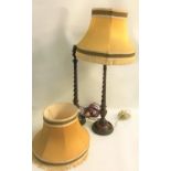 PAIR OF MAHOGANY TABLE LAMPS raised on circular bases with barley twist columns and urn shaped