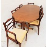 REGENCY STYLE MAHOGANY D END DINING TABLE with an extra leaf, standing on twin turned columns,