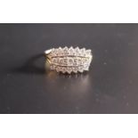DIAMOND CLUSTER DRESS RING the three rows of diamonds totaling approximately 0.75cts, on eighteen