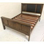 OAK PANELLED BED the shaped headboard with three panels, the footboard with three carved panels,