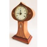 ART NOUVEAU MANTLE CLOCK the shaped mahogany case inlaid with stylised motifs with mother of
