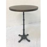 OAK CIRCULAR TOPPED HIGH BAR TABLE standing on turned metal column with four outswept feet, 109cm