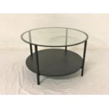 CIRCULAR METAL OCCASIONAL TABLE with inset glass top, standing on plain supports united by an