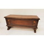 MAHOGANY BLANKET CHEST with a lift up moulded lid above a panelled front, standing on turned stout
