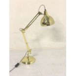 BRASS EFFECT ANGLE POISE LAMP raised on a circular base