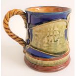 ROYAL DOULTON COMMERATIVE MUG Nelson, with relief decoration and a rope twist handle, 9.5cm high