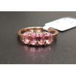 CERTIFIED PINK SPINEL AND DIAMOND RING the four oval cut pink spinels weighing 1.02cts, with a small