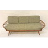 ERCOL LIGHT ELM AND BEECH SOFA/DAY BED with a shaped back, loose cushions and slatted spindle