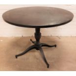 MAHOGANY TOPPED CIRCULAR DINING TABLE standing on turned metal column with four outswept feet, 100cm