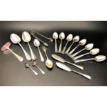 SELECTION OF ASSORTED SILVER SPOONS butter knife, sugar tongs and child's pusher, of various