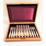 EDWARDIAN SET OF FISH EATERS comprising twelve knives and forks with elaborate decoration and mother