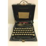 REMINGTON WORLD SERVICE PORTABLE TYPEWRITER numbered EC43172, in a travel case