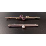 TWO NINE CARAT GOLD BAR BROOCHES one in white gold with central pearl, 4.3cm long; the other in rose