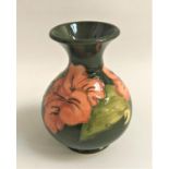 MOORCROFT HISBISCUS VASE with a green ground, 13cm high