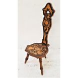 POKER WORK SPINNING CHAIR with a narrow shaped back with a pierced handle above a shaped seat,