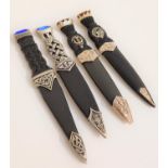 FOUR MODERN SGIAN DUBH one with a pierced metal grip, the others with faux wood grips, all with