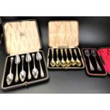 TWO CASED SETS OF SIX SILVER SPOONS comprising a set of grapefruit spoons with London hallmarks
