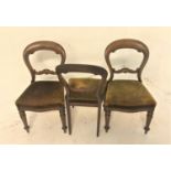 SET OF THREE VICTORIAN BALLON BACK DINING CHAIRS with shaped stuffover seats, standing on turned