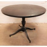 MAHOGANY TOPPED CIRCULAR DINING TABLE standing on turned metal column with four outswept feet, 100cm