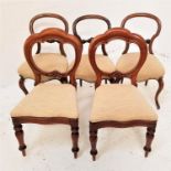 PAIR OF VICTORIAN MAHOGANY DINING CHAIRS with balloon backs above shaped padded seats, standing on