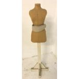 FEMALE TORSO MANNEQUIN with an adjustable horse hair waistband, on a painted wooden column with