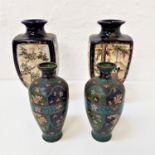 PAIR OF JAPANESE VASES raised on circular bases with four panel sides decorated with figures and