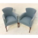 PAIR OF ARMCHAIRS with shaped backs and seats, covered in a light blue material with white motifs,