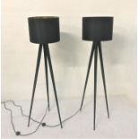 PAIR OF BLACK STEEL TRIPOD FLOOR LAMPS with circular black hessian shades with gold interior, 152.