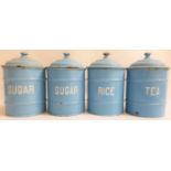 SET OF FOUR ENAMELLED KITCHEN CANNISTERS in pale blue and labelled Rice, Tea and two Sugar, all with