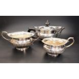 VICTORIAN THREE PIECE SILVER TEA SERVICE comprising tea pot, two handled sugar basin and milk jug,