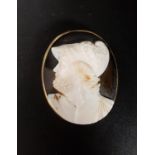 UNUSUAL HARDSTONE CAMEO BROOCH depicting a bearded male profile wearing a helmet with figure and