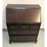 STAG MAHOGANY BUREAU with an inset fall flap and fitted interior, above three frieze drawers and two