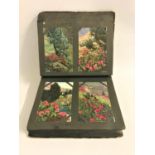 EDWARDIAN POST CARD ALBUM containing one hundred and sixty six colour postcards of flora and fauna