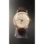 GENTLEMEN'S JAEGER LeCOULTRE NINE CARAT GOLD CASED AUTOMATIC WRISTWATCH circa 1960s, the champagne
