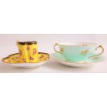 SET OF THREE COALPORT COFFEE CANS and saucers with a yellow ground and floral decoration with gilt