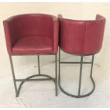 PAIR OF TUB BAR STOOLS with pink interior vinyl covering, raised on steel supports with shaped base,