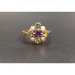 PRETTY 'SUFFRAGETTE' RING the central amethyst in peridot and pearl surround representing the