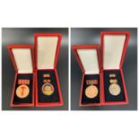 G D R MEDAL OF MERIT inscribed Verdienstmedaille Der DDR, with bar and box, together with the