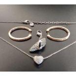 SELECTION OF SWAROVSKI CRYSTAL JEWELLERY comprising a pair of gold tone hoop earrings, a heart