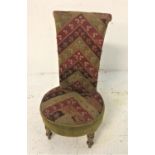 LATE VICTORIAN PRIE DU CHAIR with a tall shaped back above a circular seat, covered in a chevron