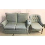MODERN TWO SEAT SOFA with loose back and seat cushions, with scroll arms, on castors, 140cm wide,