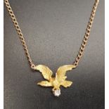 DIAMOND SET NINE CARAT GOLD EAGLE NECKLACE the moulded eagle shaped pendant section with feather