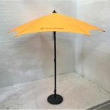 VEUVE CLICQUOT BRANDED ORANGE GARDEN PARASOL with weighted circular stand and cover for umbrella,